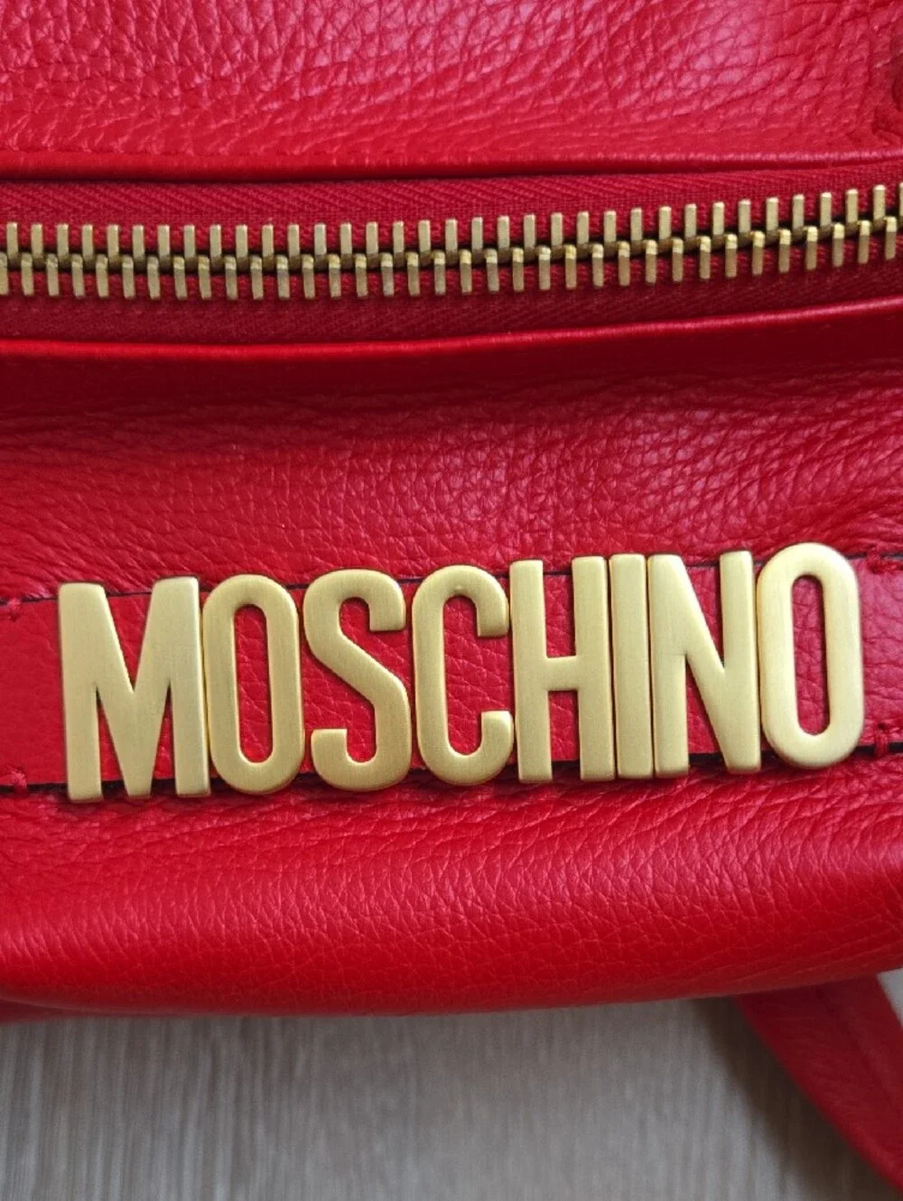 Moschino Red Pebbled Leather Mini Backpack with Gold Logo